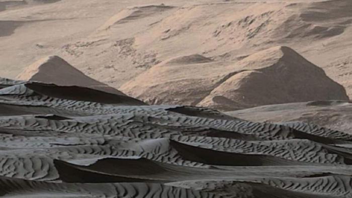 a large dune field with sharp preserved crests and fine uniform sediment